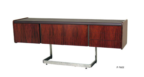 CREDENZA: 1970's modern rosewood & Hershey brown on chrome L-shape legs w/three small drawers, two doors, four loose shelves in side, one large drawer, 72" X 19" X 29-1/4"H