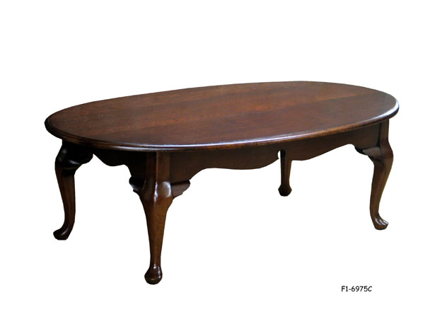 COFFEE TABLE: Traditional style, mahogany finish, overhanging oval top, queen Anne legs, side apron, 48" x 26-1/4" x 15-3/4"H