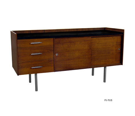 CREDENZA: 1960's Modern, teak stained walnut with black laminate inset top, three drawers with aluminum pulls, 1 Loose Shelf Inside behind two sliding doors, four 1" square steel legs. 55"W x 18-3/8"D x 28"H. SPECIAL PACKING
