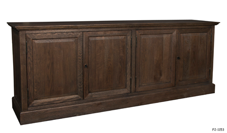 SIDEBOARD: Traditional "French Panel" Brown Oak Finish, Overhanging Cornice Molded Top, Four Panel Doors-Two with Pull; Two Loose Shelves Inside-One at Each End, Attached Casters, 90"W x 17-3/4"D x 35-1/2"H