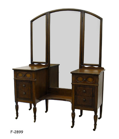 VANITY WITH THREEFOLD MIRROR: 1920's style walnut 2 pedestal with low center shelf & fluted legs with casters, 50" x 19" x 66-1/2"H SPECIAL PACKING